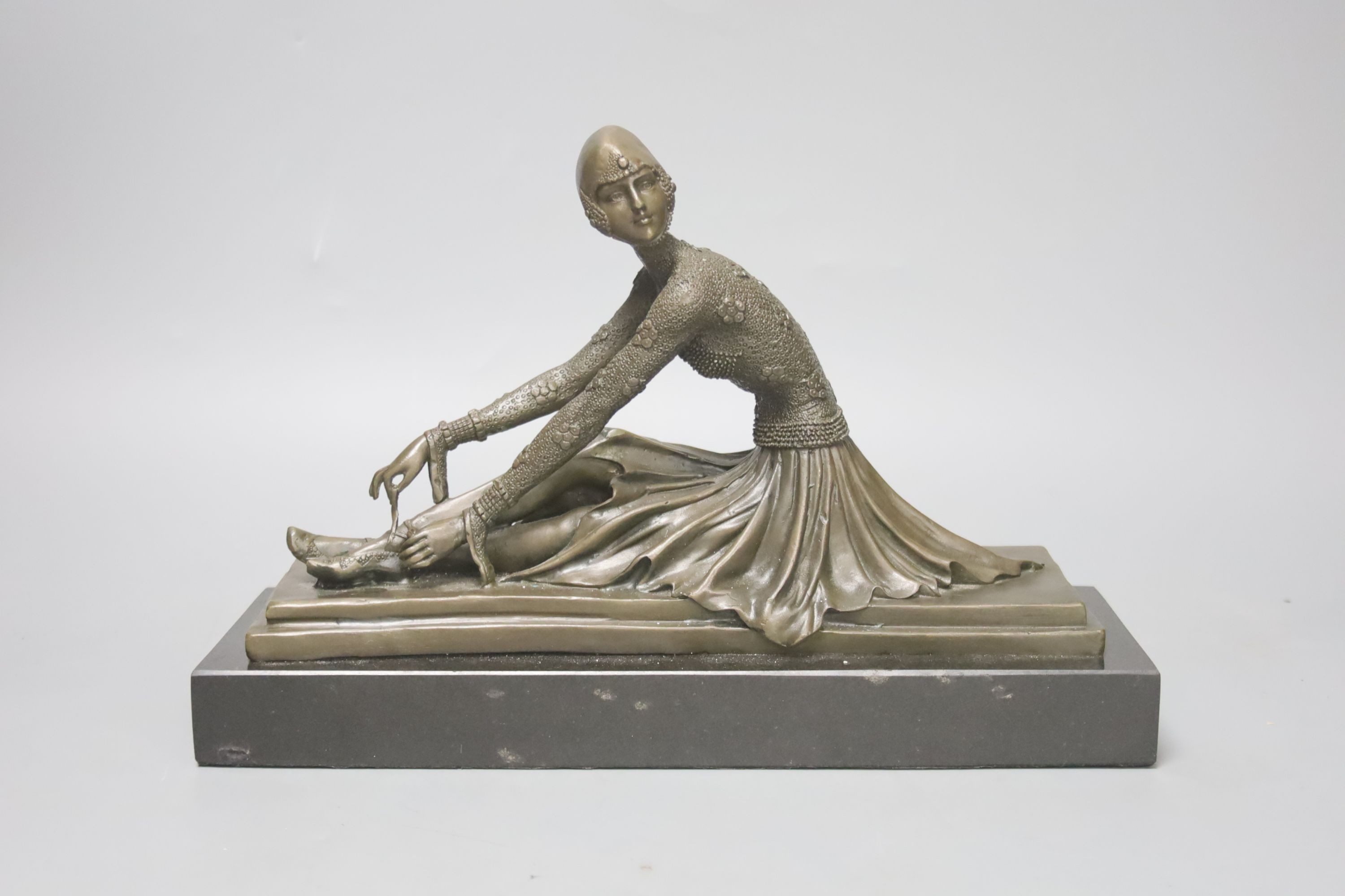 Bronze statue, after Demetre Chiparus of a seated ballerina; 29cm L x 19cm H x 10cm W